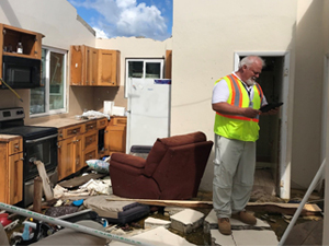 inspector at a damaged structure