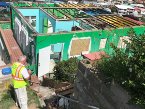 inspector at a damaged structure