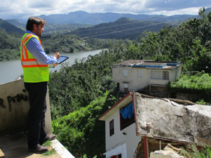 Inspector looking over damaged homes